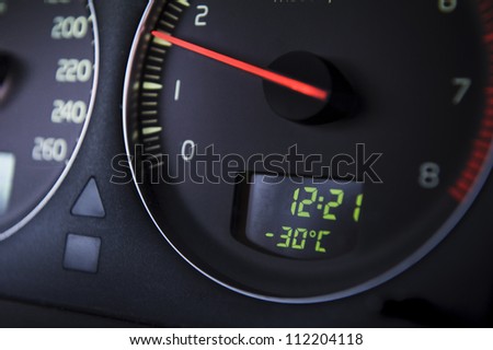 Car Odometer with thermometer reading minus thirty Celsius degrees