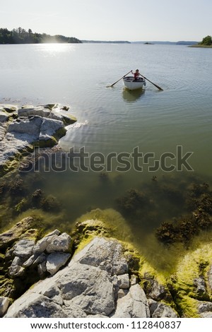 A boy rowing, the Baltic Sea, Sweden.