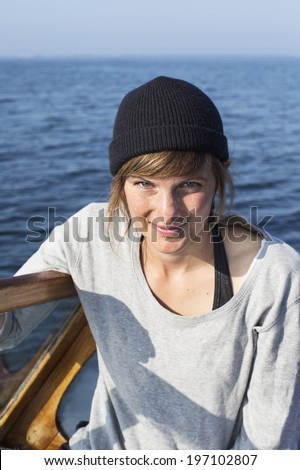 Smiling woman on boat, Sweden