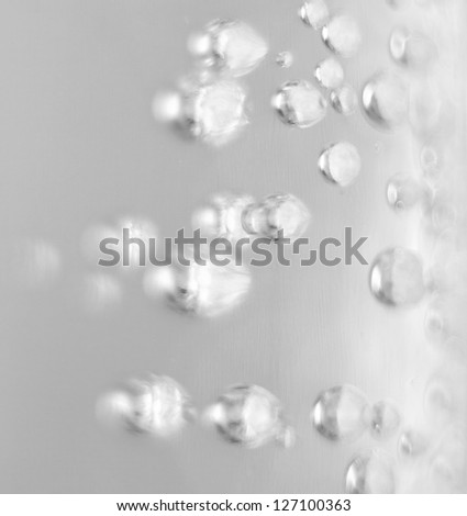 Oxygen. Water. Water background. Macro.Texture.Glass with water. Natural. Bubbles of oxygen. Water enriched with oxygen. Mineral water. Neutral background.Water texture.Abstract. Air.