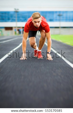 sports,start, beginning, path, concept, fighting, strength, success, one, leader, win, winner, sportman. athlete starts on the running track