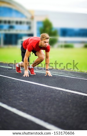 athlete starts on the running track. sports,start, beginning, path, concept, fighting, strength, success, one, leader, win, winner, sportman