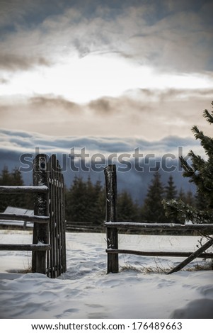 Old wooden open gate in the mountains/Gate to the sunny side/