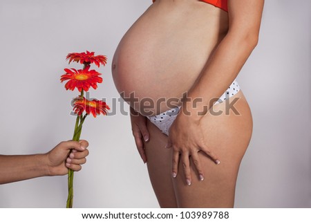 tummy of the pregnant woman