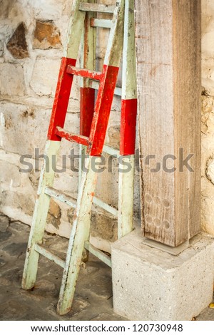 Wooden ladder against the wall