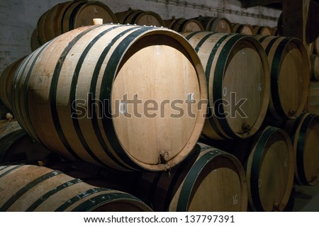 Wooden beer barrels with iron rings in the cellar, brussels, belgium