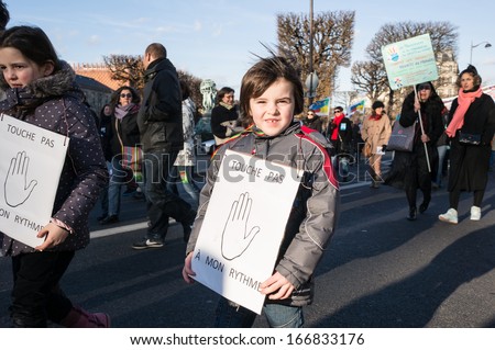 PARIS - DECEMBER 5: A French pupil demonstrate against the change of the rhythm of elementary school on December 5, 2013 in Paris, France. This controversial change began this September.