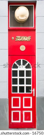 Red wooden door of a Chinese restaurant in Bruges, Belgium