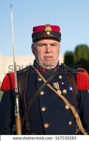 DOUAUMONT, FRANCE - NOVEMBER 11: Man in uniform of French army in World War I in the Armistice Day on November 11, 2013 near Verdun, France. The year of 2014 is the centennial of the first world war.