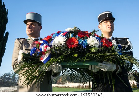 VERDUN, FRANCE - NOVEMBER 11: French military officers present flowers in the Armistice Day on November 11, 2013 near Verdun, France.  The year of 2014 is the centennial of the first world war.