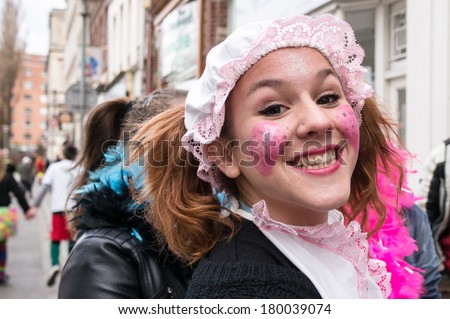 DUNKIRK, FRANCE - MARCH 2, 2014: A disguised girl on the street. Dunkirk holds the biggest and most popular carnival in northern France.