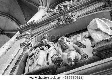 Statue of crying angel in the Cathedral of Notre Dame, Amiens, France