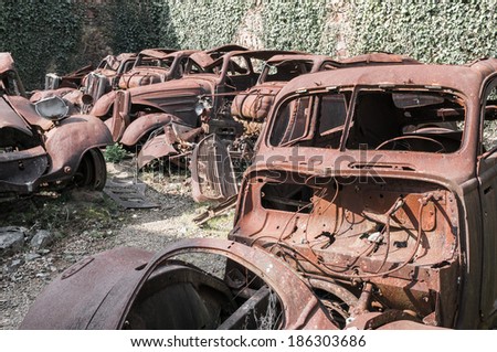 old rusty deserted cars in Oradour sur Glane, France. In this village, 642 of its inhabitants were massacred by a German Waffen-SS company in the second world war.