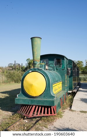 CAMARGUE, FRANCE - SEPTEMBER 3, 2013: Little train by the Vaccares lake. This little train of Mejanes will the tourists discover the variety of the landscapes of Camargue.