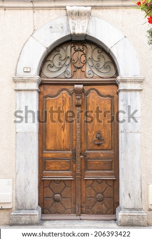 Old wooden door in Lourdes, Hautes Pyrenees, France