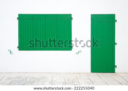 Minimalist green wooden window and door in La Flotte, Ile de Re, France