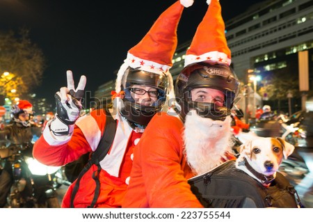 PARIS - DECEMBER 19: Motorcycle riders disguised as Santa Claus demonstrate on the street on December 19, 2013 in Paris, France. This demonstration is held annually since 2002.