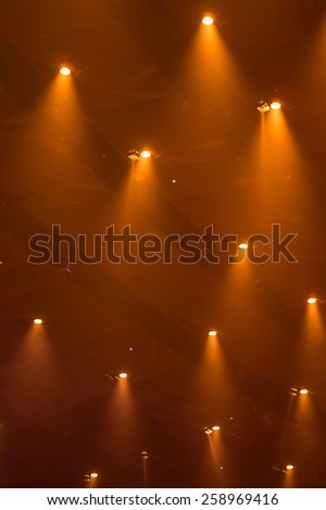 Orange Lights through the smog on a concert