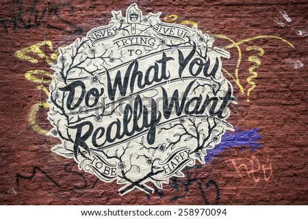 AACHEN, GERMANY - DECEMBER 6, 2014: Graffiti with a sentence: Do what you really want. Aachen is a city with population of 260,000 in North Rhine-Westphalia.