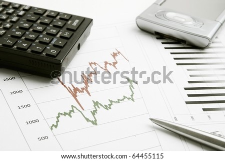 Business background with graph, pen, calculator and PDA
