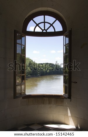 View out over a wide river through an open window