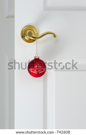 Christmas coming / Red christmas ball on the door