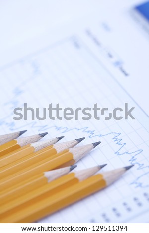 Financial paper with a pencil in a row, close up