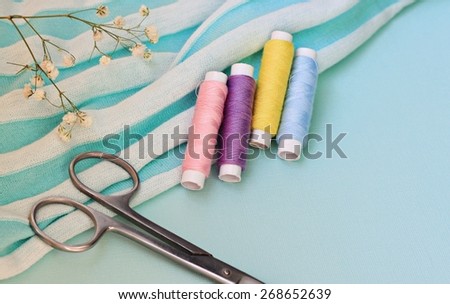 Threads and scissors craft background