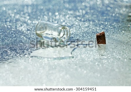 sparkling shiny empty background drops spilt water bottle magical radiance essence liquid shallow focus blurry cool tones