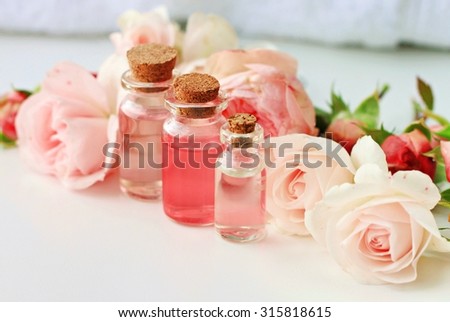 Rose spa setting aromatic water in bottles natural freshness soft delicate flowers feminine beauty
