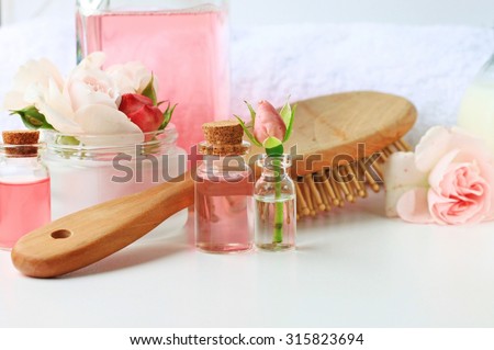 Rose water  botanical hair products treatment, vials jars comb towel tonic home spa setting, feminine secret, blank space, soft delicate focus