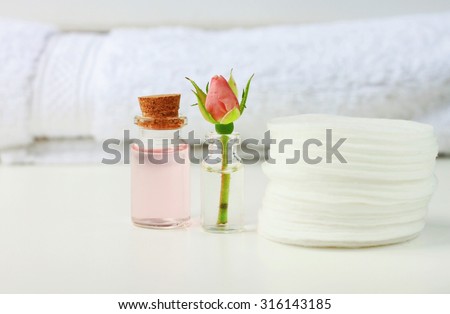 Rose attar cleaning tonic water fresh flower white cotton pads and towel, empty space, soft focus, bathroom daily care