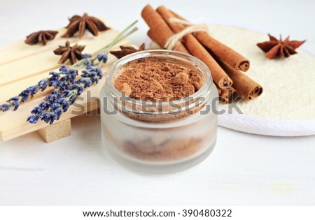 Chocolate facial spa treatment. Jar of cocoa cosmetic butter, loofah body scrubber, lavender and cinnamon aromatherapy.