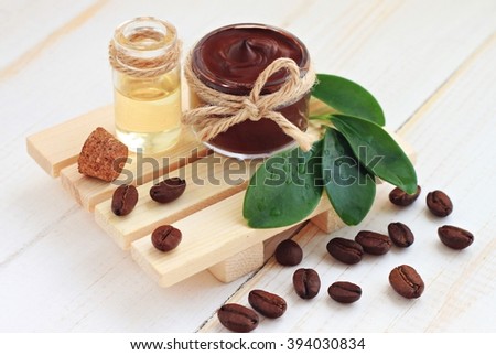 Chocolate body skin treatment, mask in jar,coffee scattered,aroma oil.