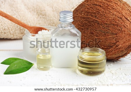 Coconut oil products cosmetic use. Skincare benefits. Bottles coconut oil, coconut milk, shavings.