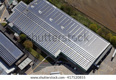 aerial view of solar panels pv cells on a factory roof in the UK