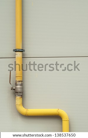 yellow gas pipe with a crane and valve