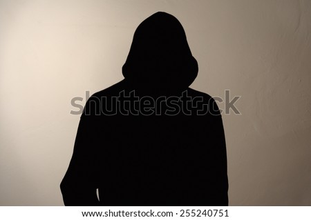 Invisible man in the hood. grey background.