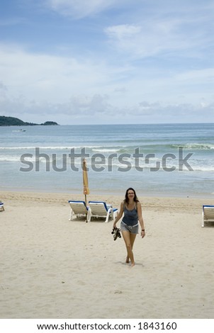 Woman walking on a deserted Tsunami hit beach