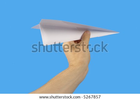 The Hand, keeping paper plane, on turn blue the background.
