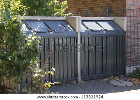 Modern  metal containers for  garbage  recycling at the yard of building