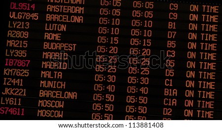 Airport Schedule board showing flight status and gate numbers