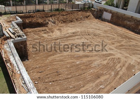 Construction site in the city. Foundation pit for the construction of an underground garage under the apartment building