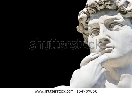 Detail close-up of Michelangelo\'s David statue on black background, with place for your design or text