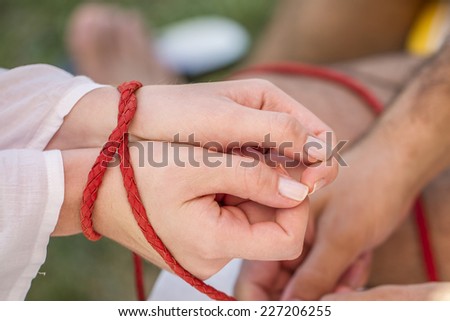 Man Trapped Woman With A  Red Rope