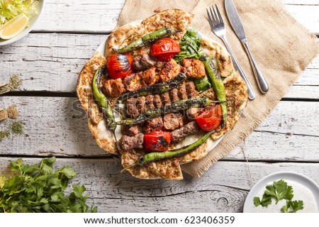 Turkish and Arabic Traditional Ramadan Mix Vali Kebab Plate inside Adana, Urfa, Chicken, Lamb, Liver and Beef on bread and lahmacun.