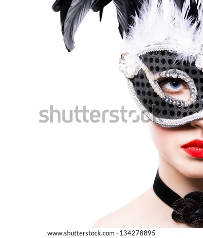 Beautiful young woman in black carnival mask on white background