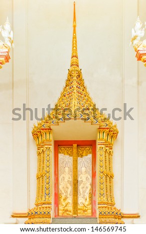Stucco work, of the temple doors (Thailand style). (What about religion in Thailand is public).