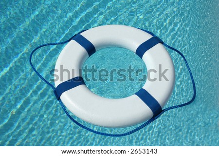 White and blue life buoy in the water