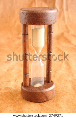 Sand watch on a color background